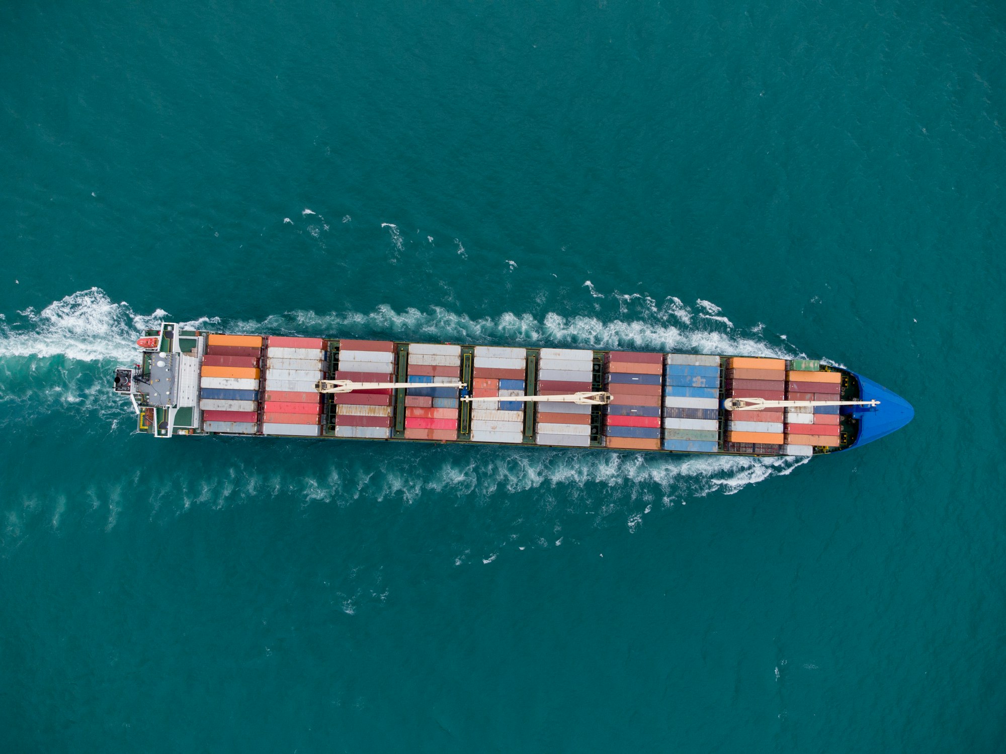 Aerial view of cargo container ship in the sea